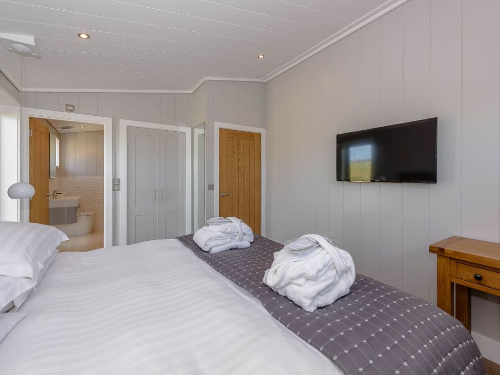 A bedroom with a bed and a television at Wellington in Wigton