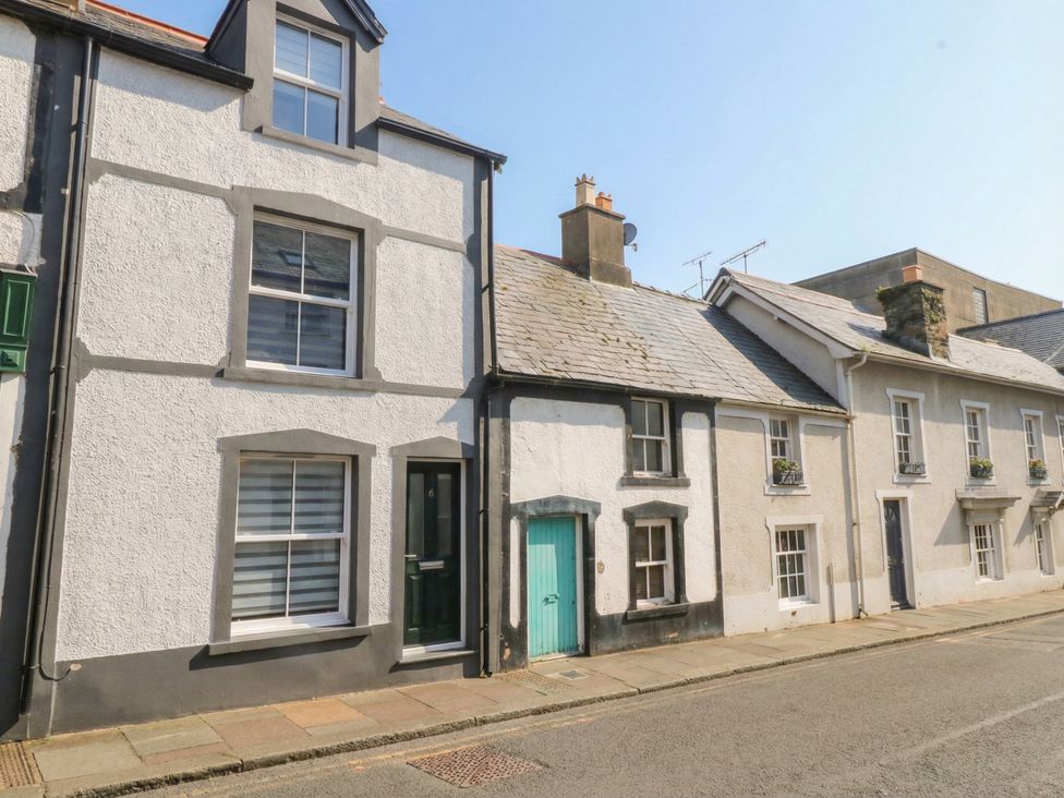 A row of houses with windows and a door in Conwy