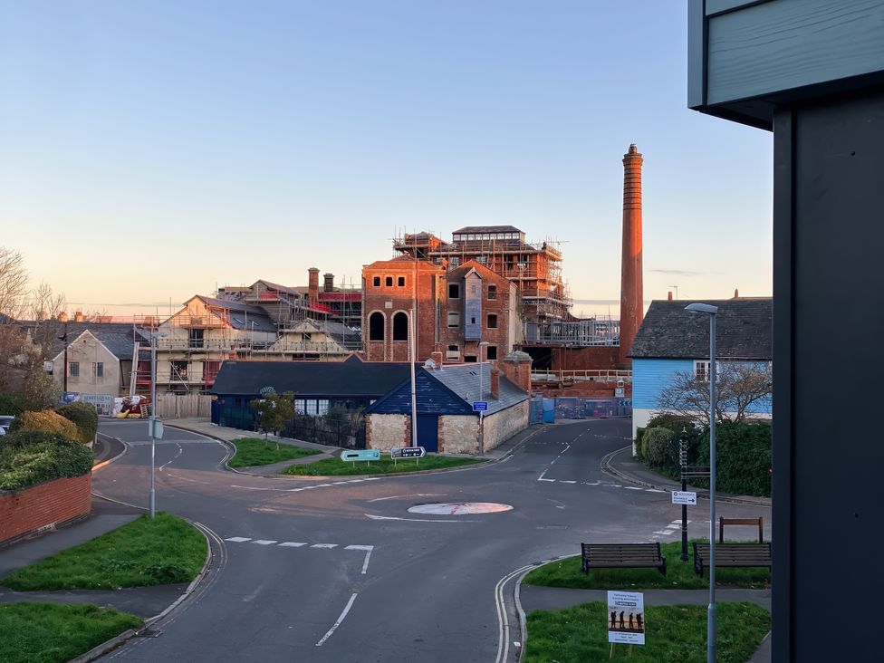A construction site with a chimney near a roundabout at 12 Brewhouse Place Weymouth