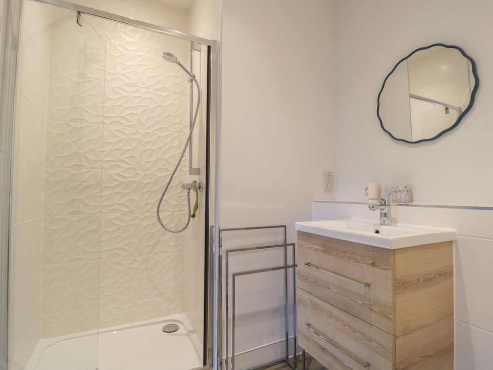 A bathroom featuring a shower and a sink at Brewery View in Weymouth