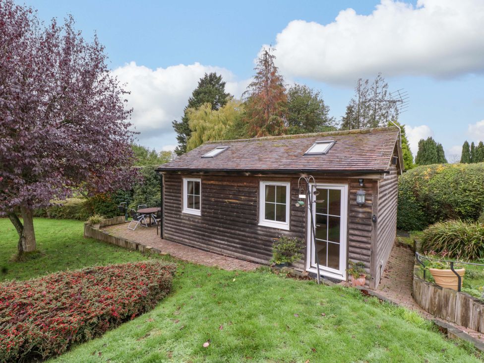 A cabin in a garden at The Log Cabin in Corse near Gloucester