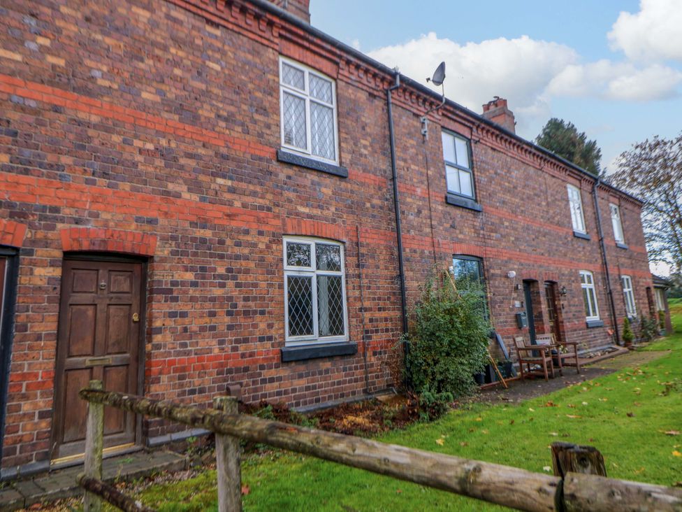 An outdoor view of a brick building with a garden at Shunter’s Nook Stafford