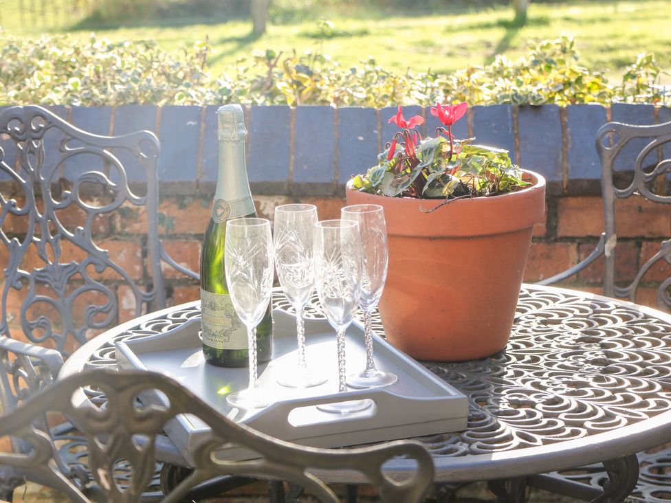 A table with a bottle and glasses at Shunter’s Nook in Colwich