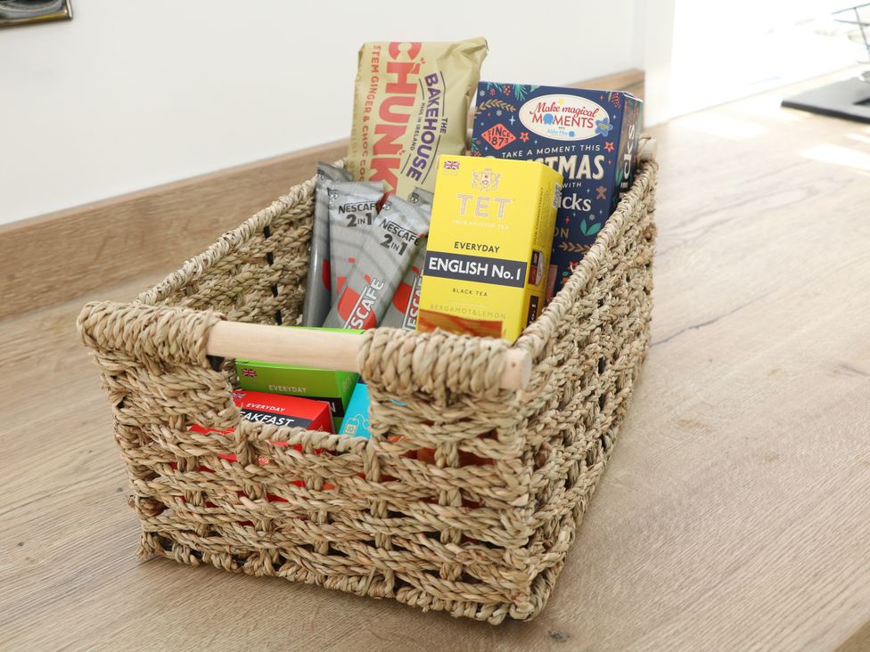 A basket filled with snacks and beverages at Shunter’s Nook in Colwich