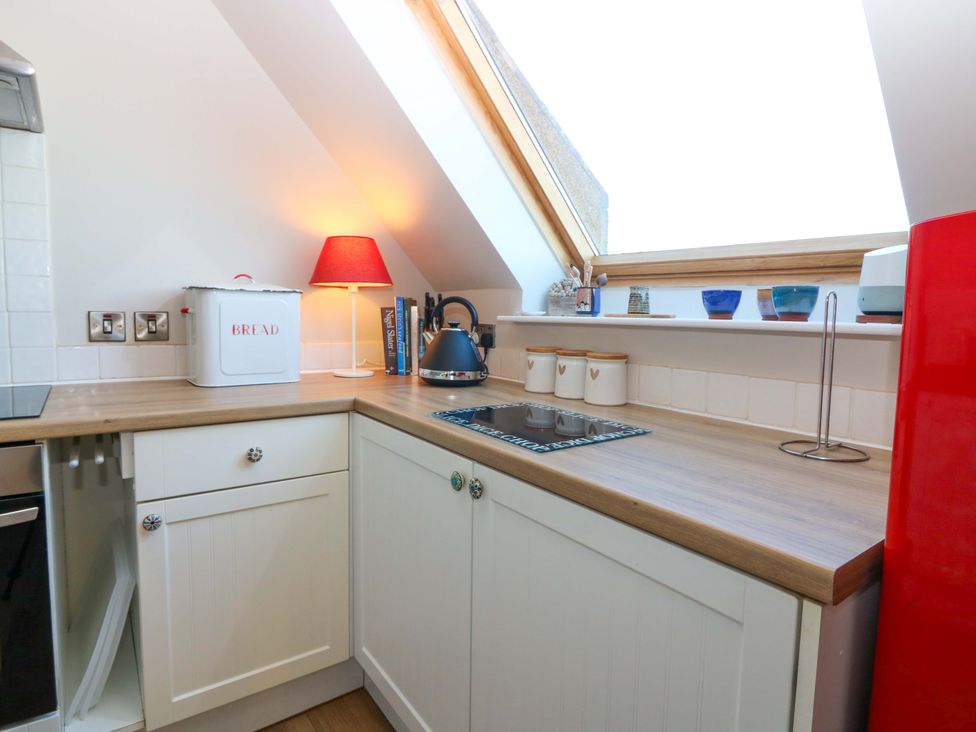 A kitchen with a kettle and a bread box at Bridle Cottage in Cove