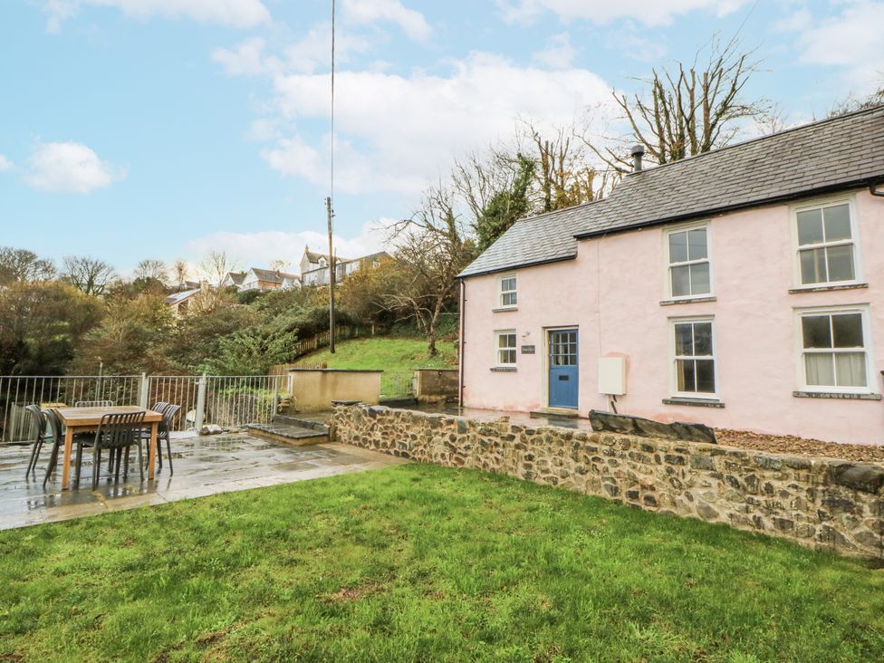 A house with a patio and garden area at Fronglyd in Aberporth