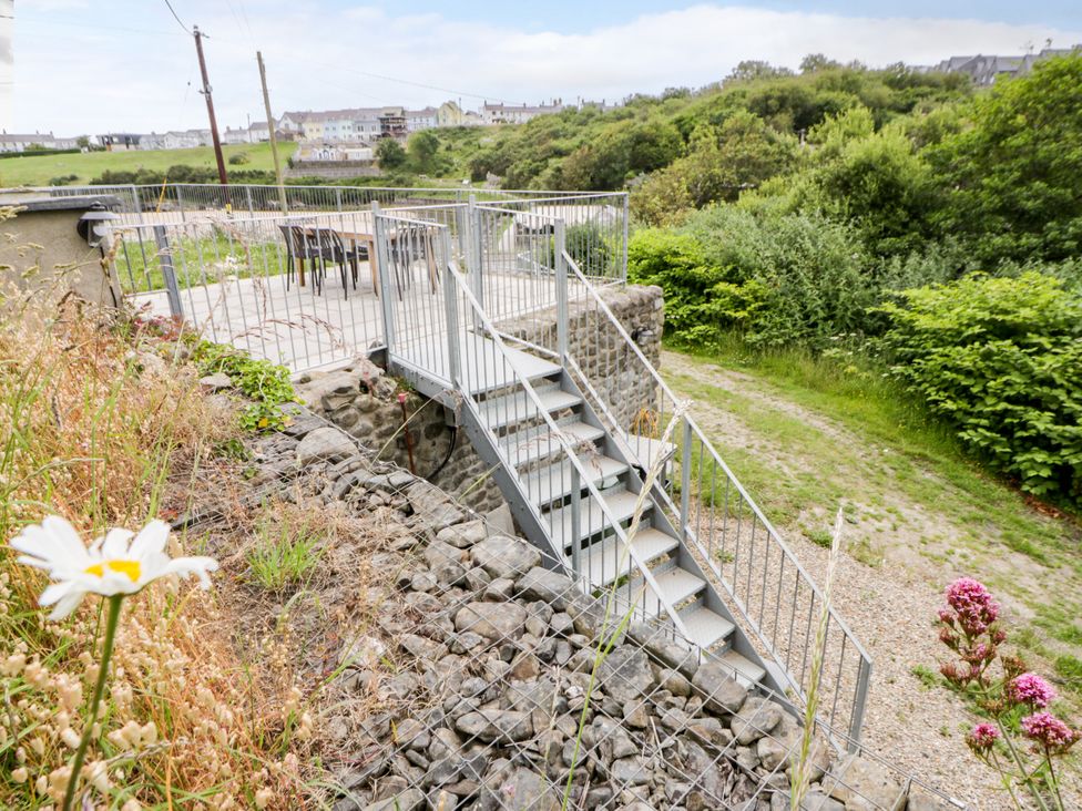 Steps leading to a patio area at Fronglyd in Aberporth