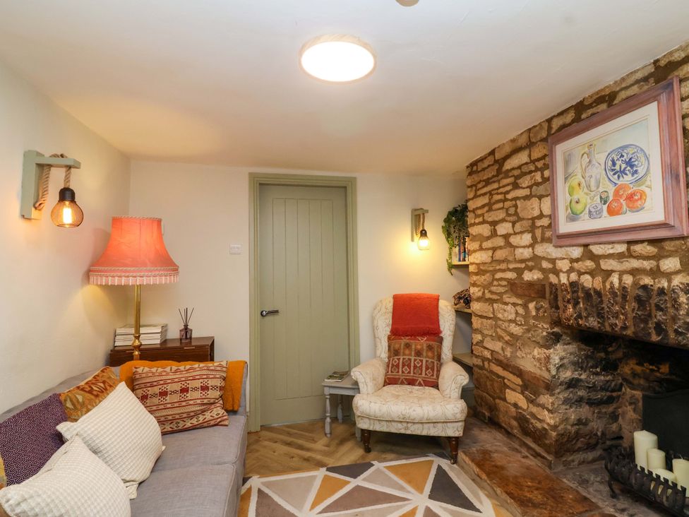 A living room with a sofa and armchair at 29 Spring Street Chipping Norton