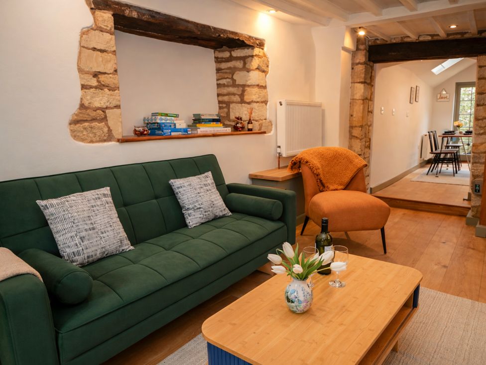 A living room with a sofa and coffee table at Burford Apple in Burford