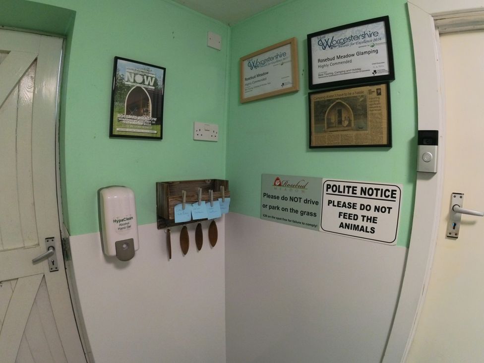 An entrance area with notices and certificates at Rosebud Meadow Pod 1