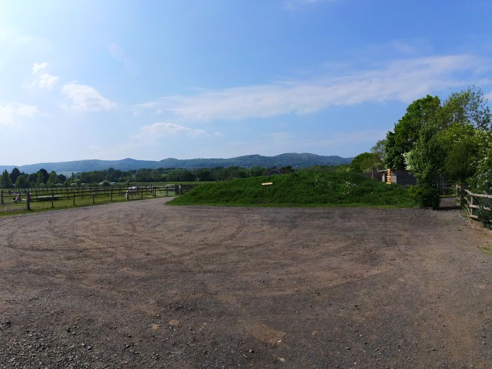 An outdoor area with a dirt path and distant mountains at Rosebud Meadow Pod 1