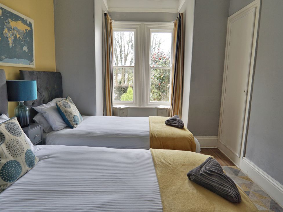 A bedroom with two beds and a window at Roselyn House in Par