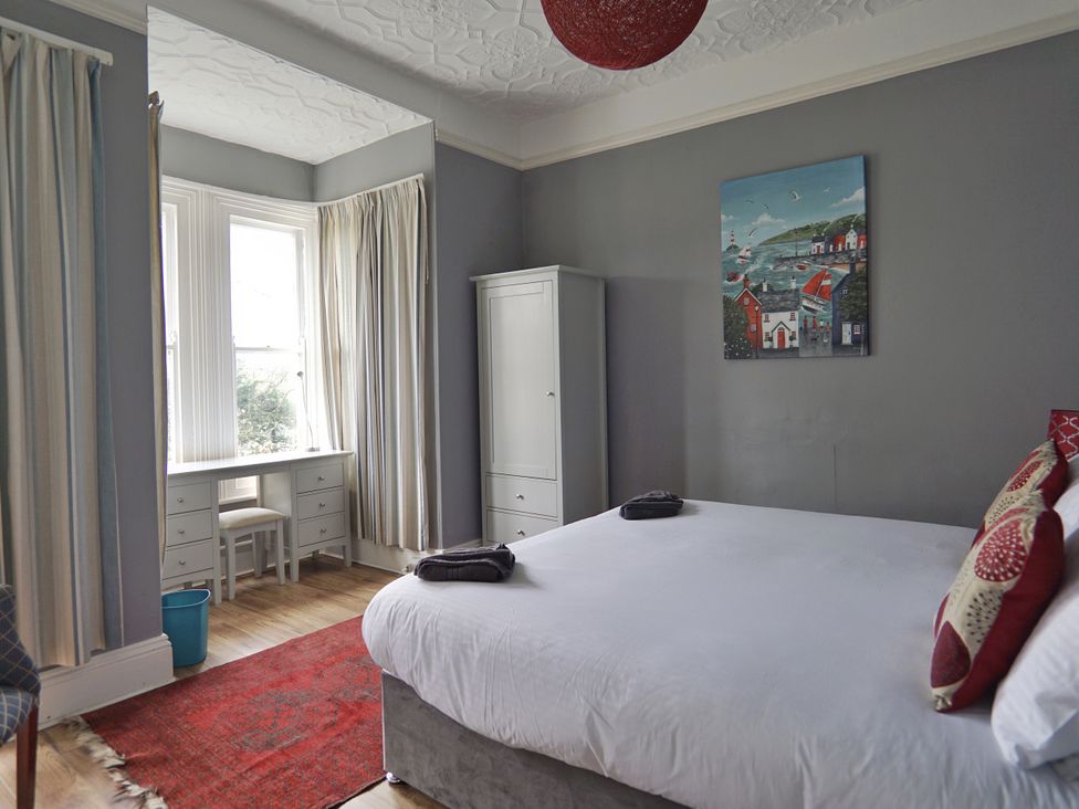A bedroom with a bed and desk at Roselyn House in Par