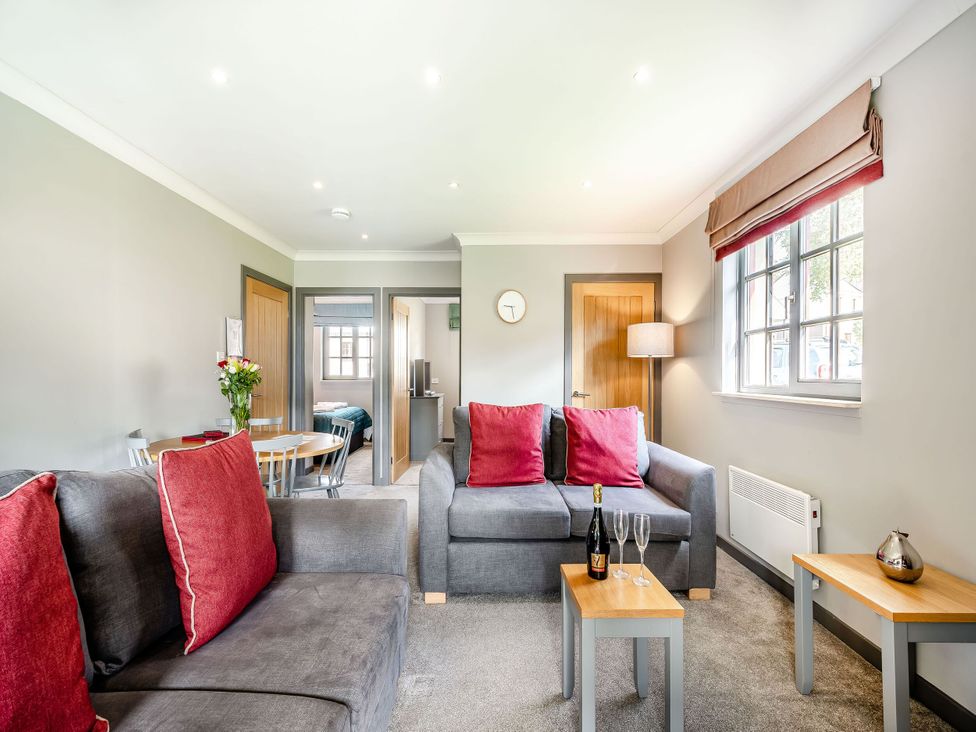 A living room with a sofa and a table at Bargany in Girvan