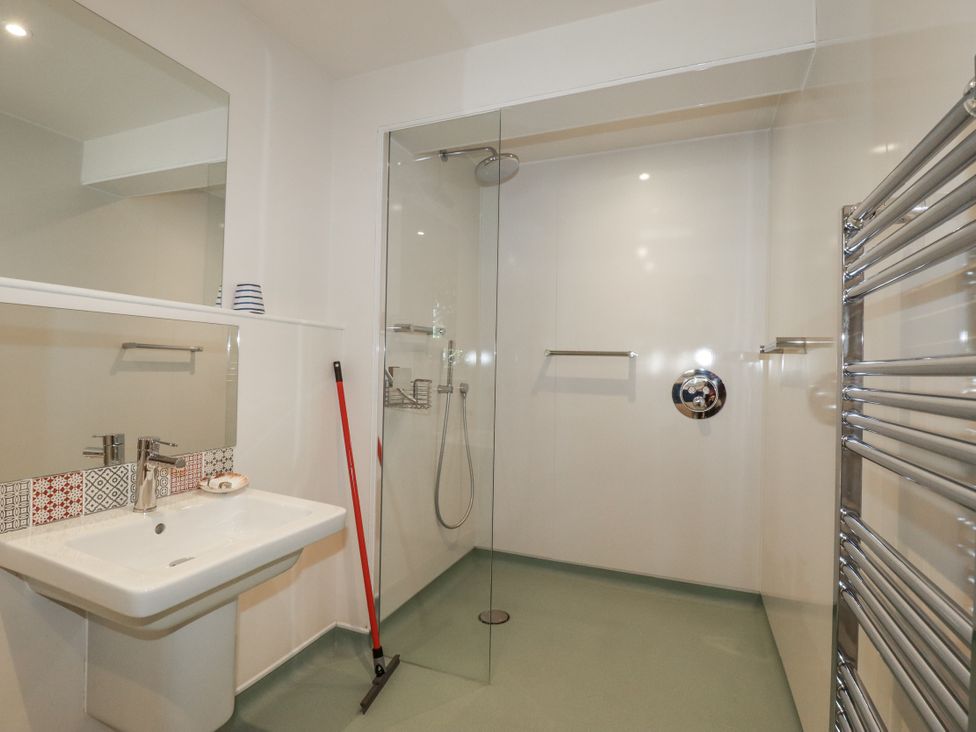 A bathroom with a shower and a sink at Hillbre in Trevone
