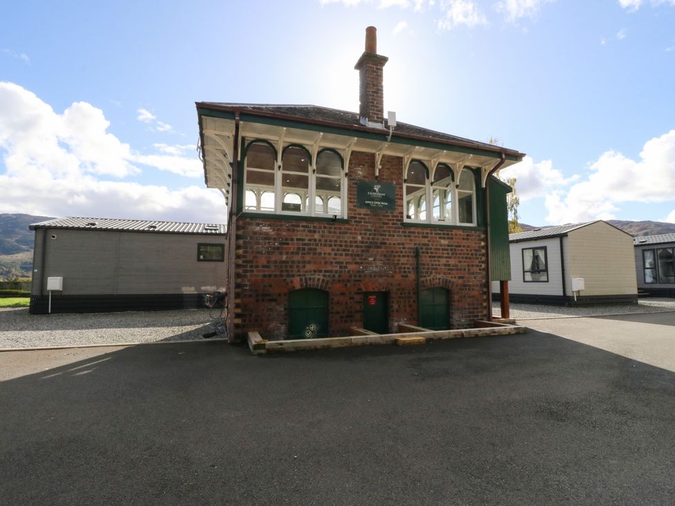 A building with windows and a chimney at Altair Lodge