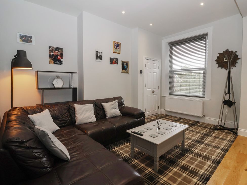 A living room with a sofa and coffee table at Flat 2 23 Hyde Park Road in Harrogate