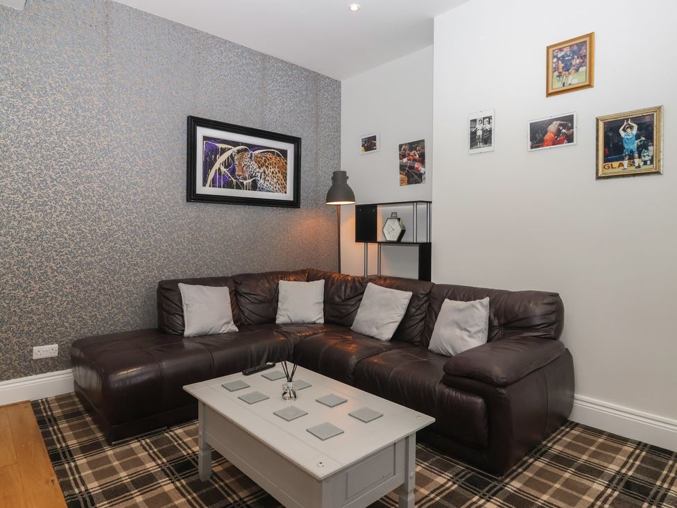 A living room with a sofa and coffee table at Flat 2 23 Hyde Park Road Harrogate