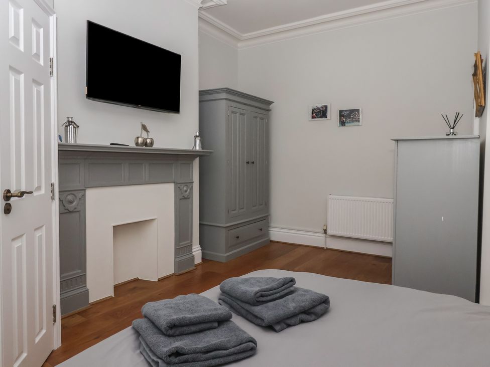 A bedroom featuring a television and wardrobe at Flat 2 23 Hyde Park Road Harrogate