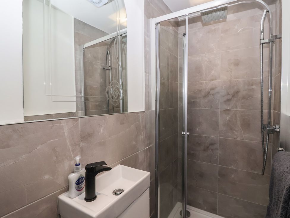 A bathroom with a shower and a sink at Flat 2 23 Hyde Park Road Harrogate