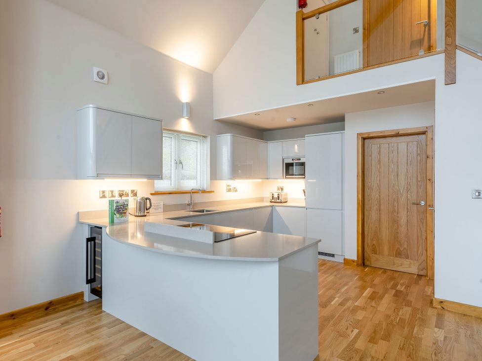 A kitchen with counter and appliances at Tranquillity 3 in Warton near Carnforth