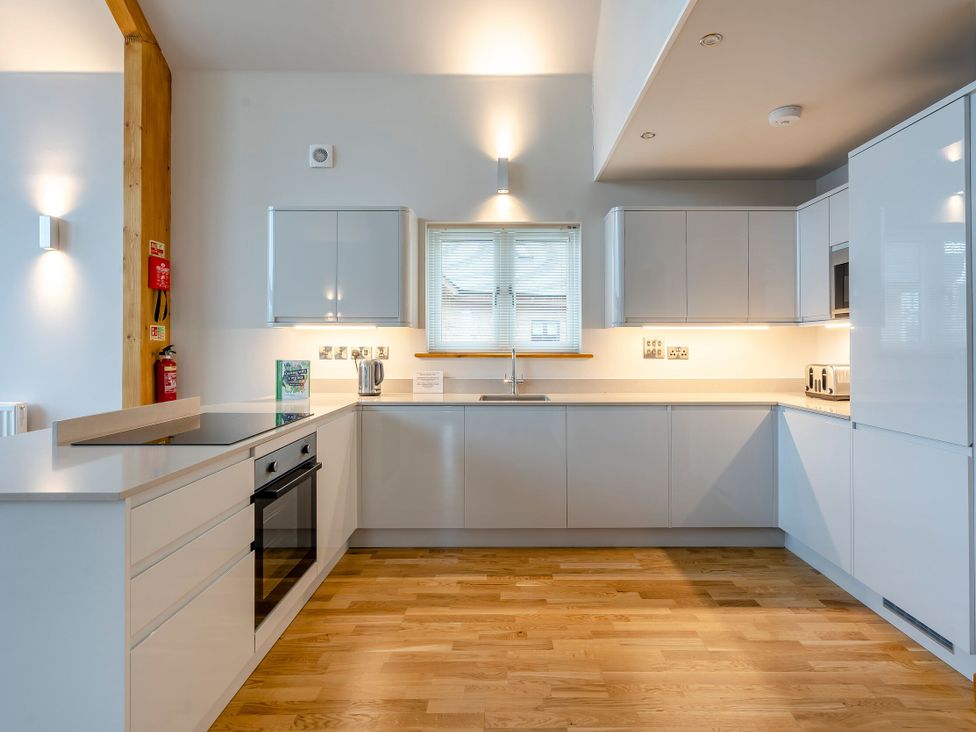 A kitchen with an oven and sink at Tranquillity 3 in Warton near Carnforth