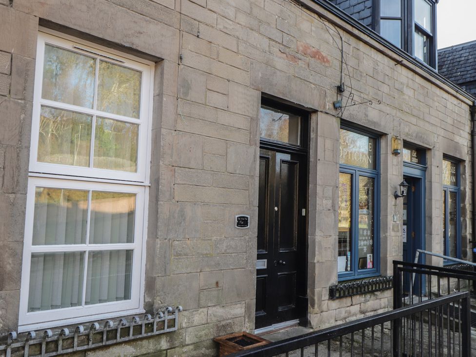 An entrance with a door and windows at Wee Flat in Avoch