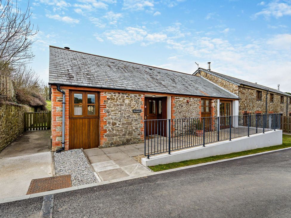 An outdoor view of a building with a stone exterior at Barley Park in Marhamchurch
