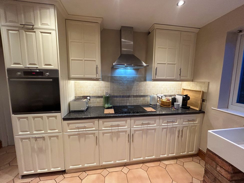 A kitchen with appliances and storage at Scamnel in Eccleshall