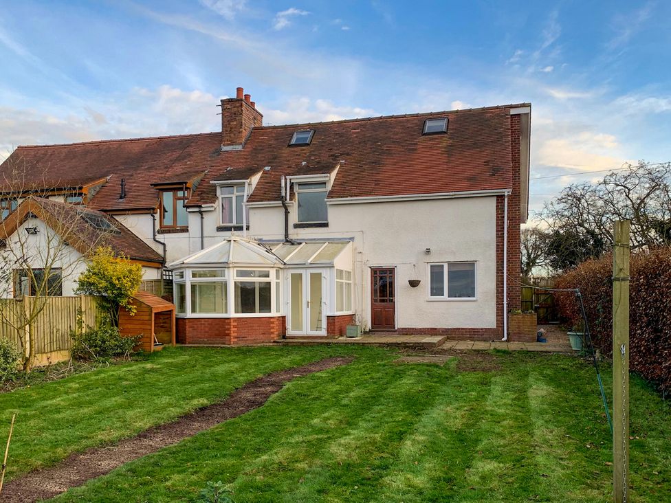 A house with a conservatory and garden at Scamnel in Eccleshall