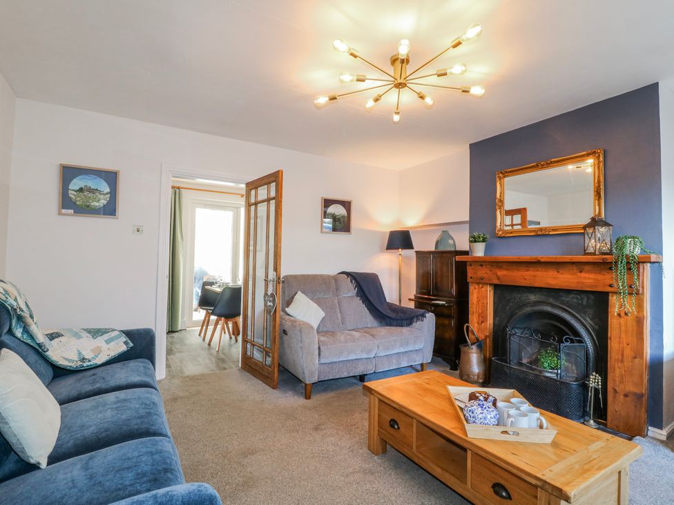 A living room with a sofa and coffee table at Scamnel in Eccleshall