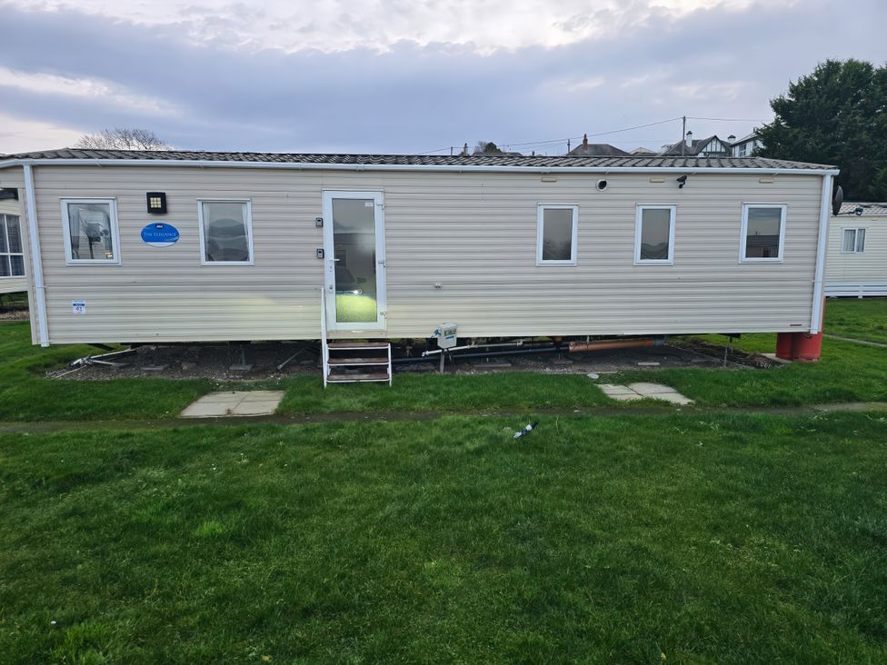 A static caravan with steps and windows at Brynowen Holiday Park - Holiday Accommodation 22432 in Borth