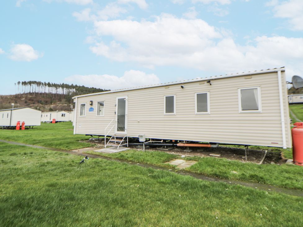 A mobile home with steps and windows at Brynowen Holiday Park - Holiday Accommodation 22432 Borth