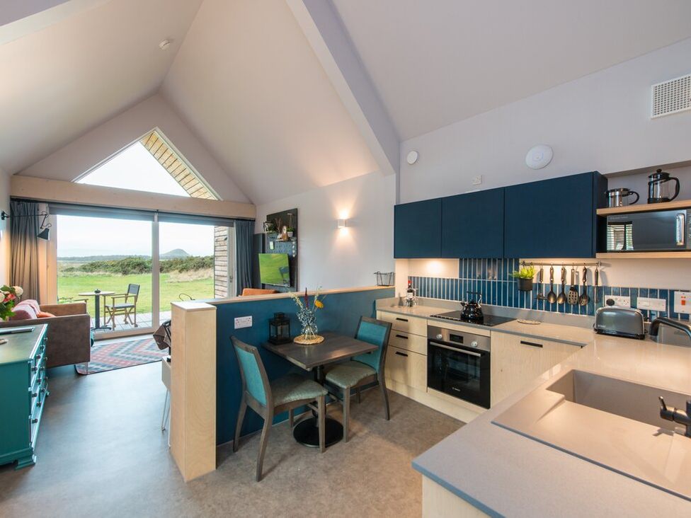 A kitchen with dining area and living space at The Weir in North Berwick