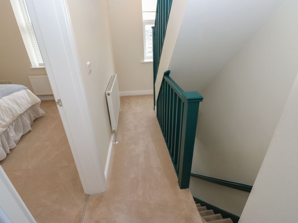 A hallway with a staircase at 11 Bronte Street, Haworth