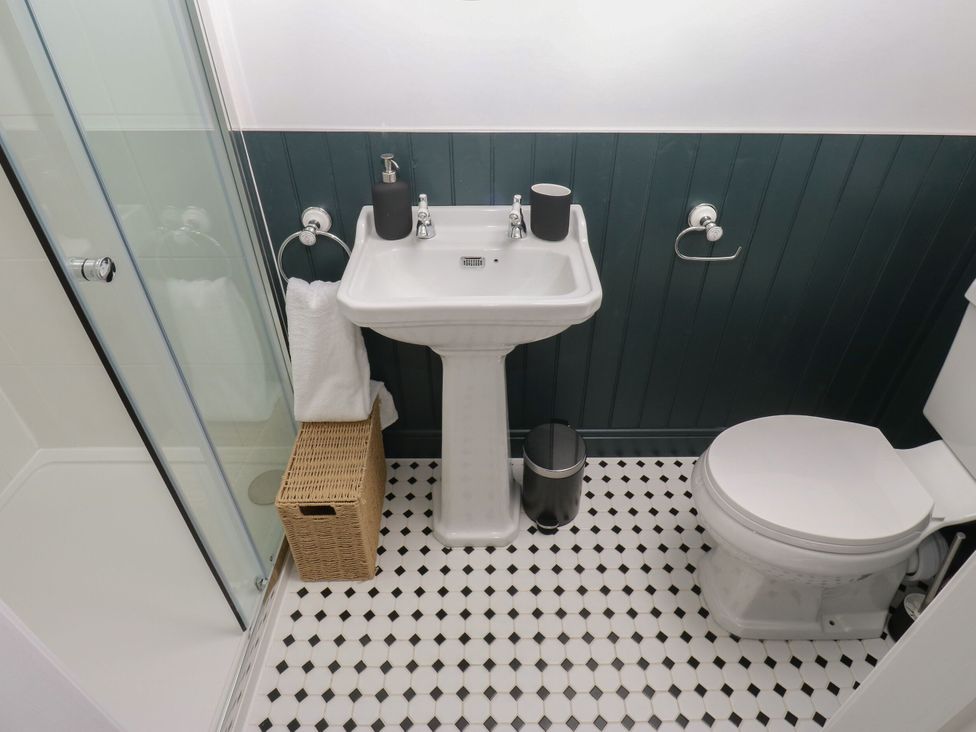 A bathroom with a sink and toilet at 11 Bronte Street Haworth