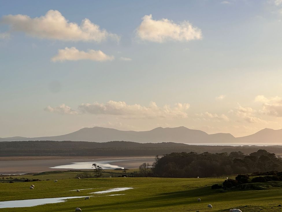 A landscape view with mountains and sheep at Pistyll Ddu, Llanfairpwllgwyngyll