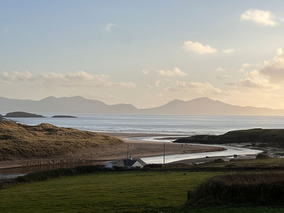 A beach view with mountains in the background at Pistyll Ddu, Llanfairpwllgwyngyll