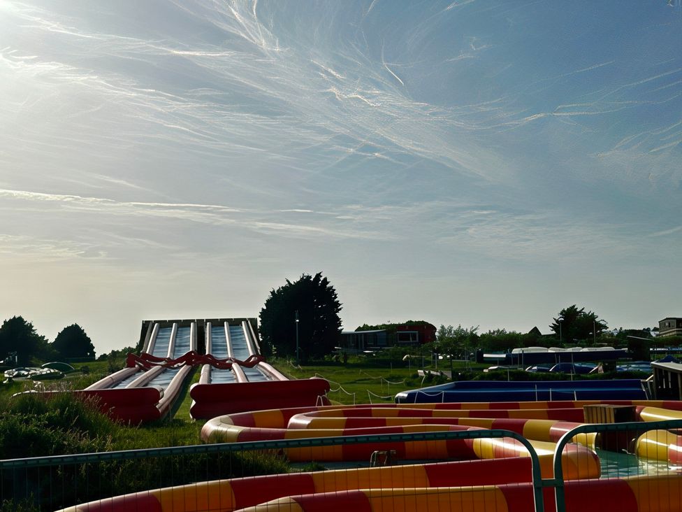 Water slides and inflatable pools at Poolside 66 Atlantic Reach Resort, Newquay, Cornwall