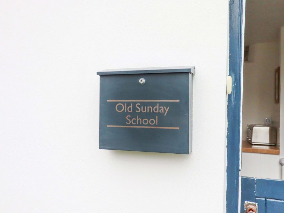 A mailbox labeled Old Sunday School at the entryway of Old Sunday School in Welcombe near Kilkhampton