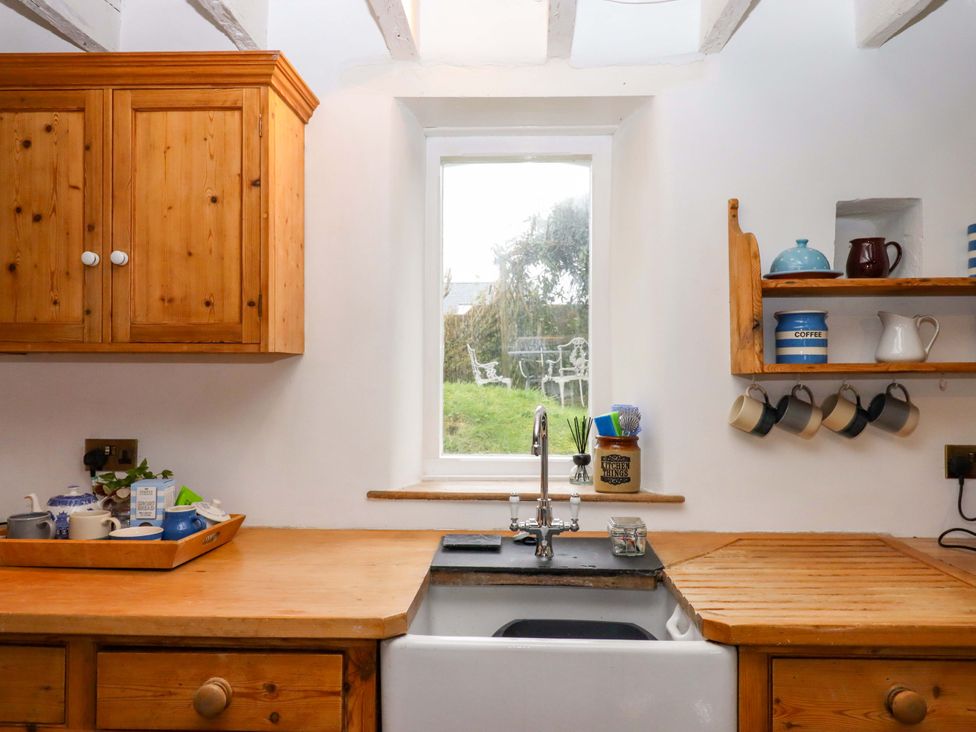A kitchen with a sink and cabinets at Old Sunday School in Welcombe near Kilkhampton