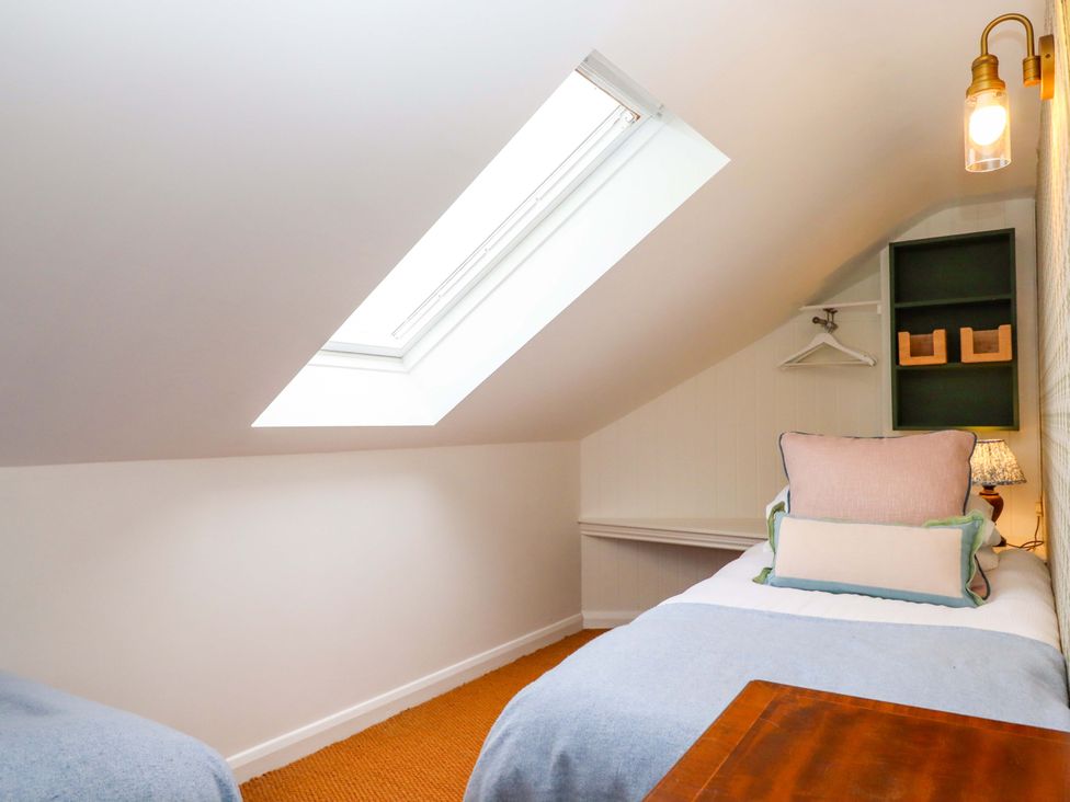 A bedroom with a skylight and a bed at Old Sunday School in Welcombe near Kilkhampton