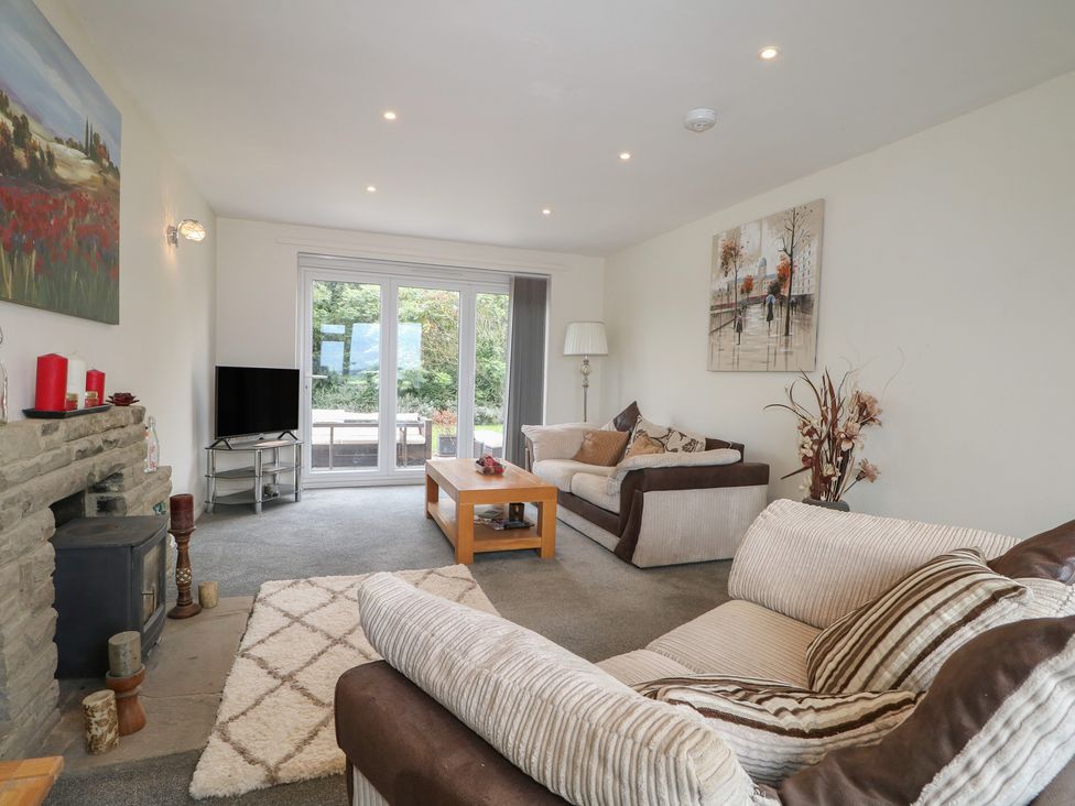 A living room with a sofa and coffee table at Walmer Court Farmhouse in Deal