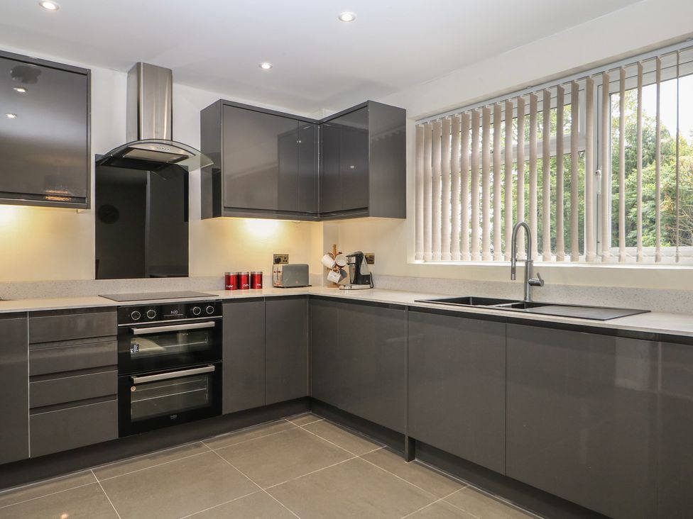 A kitchen with cabinets and appliances at Walmer Court Farmhouse in Deal