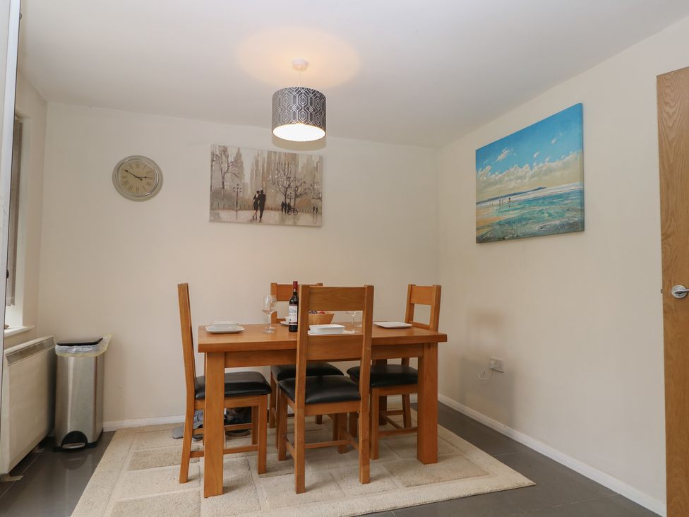 A dining room with a table and chairs at Walmer Court Farmhouse in Deal