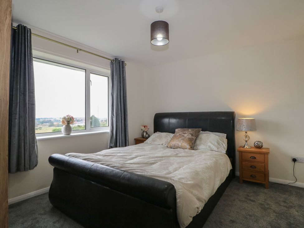 A bedroom with a bed and window at Walmer Court Farmhouse in Deal