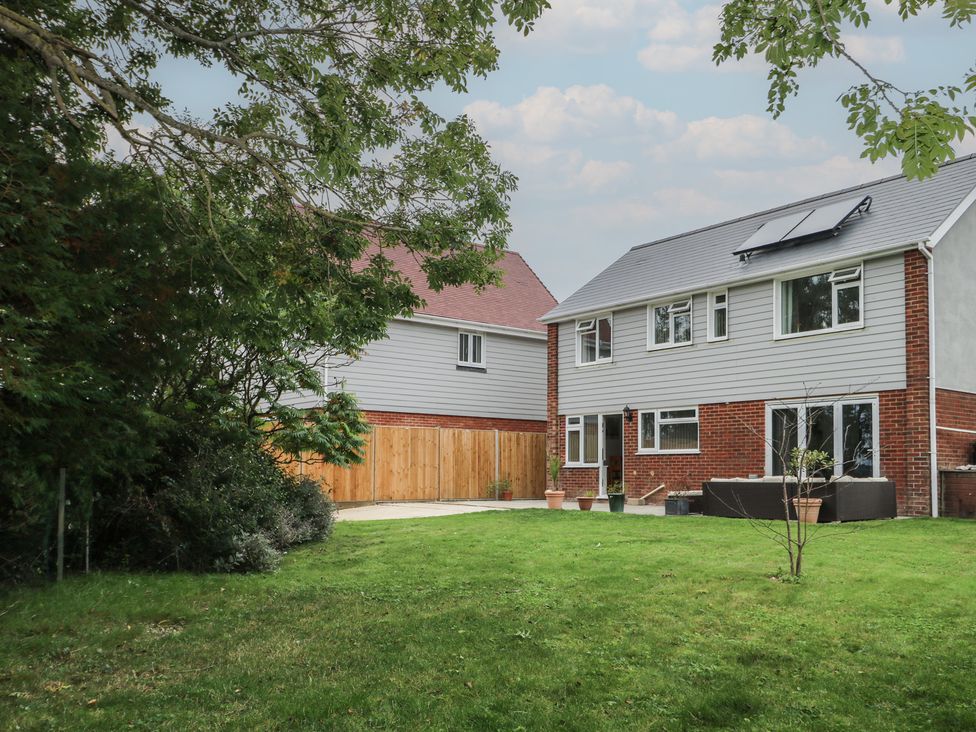A house with a garden and patio at Walmer Court Farmhouse in Deal