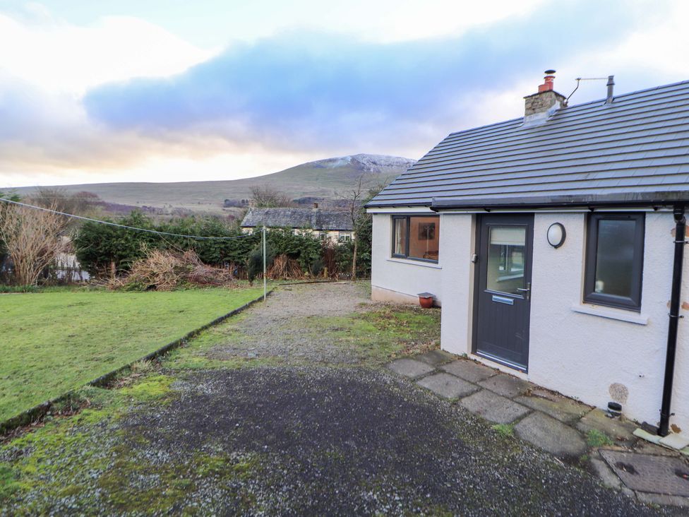 A garden with a house and mountain view at Westerlodge Threlkeld near Keswick