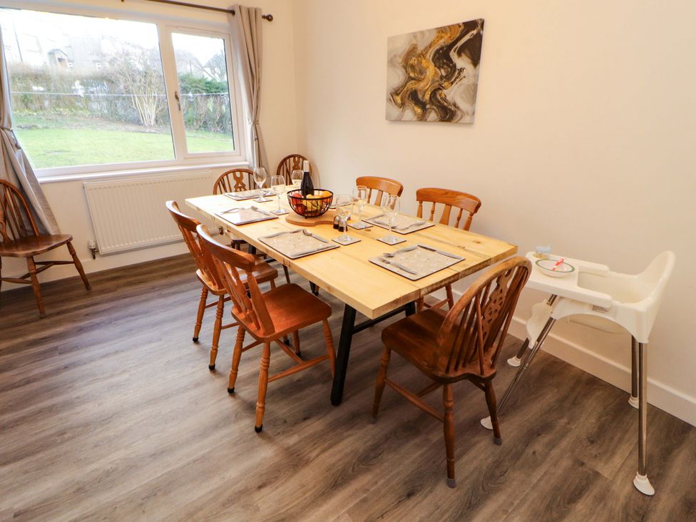 A dining room with a large table and chairs at Westerlodge Threlkeld near Keswick