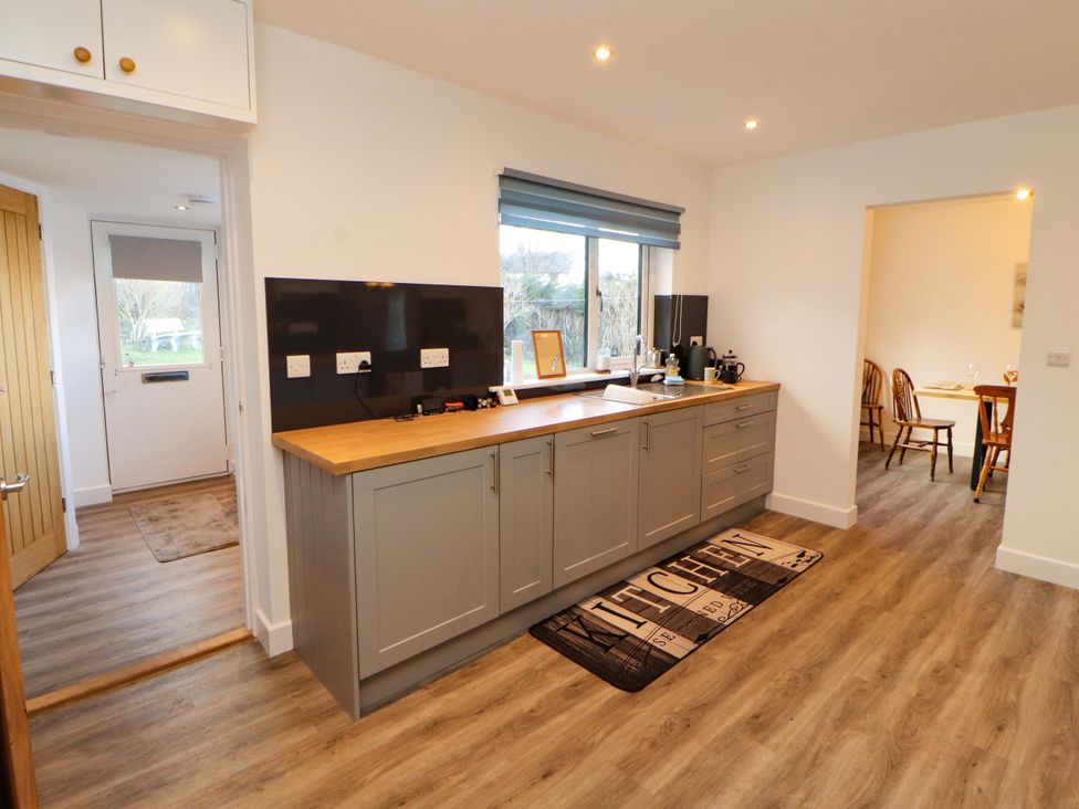 A kitchen with cabinets and a sink at Westerlodge in Threlkeld near Keswick